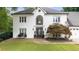 Beautifully landscaped front yard highlighting the two-story home at 5286 Wild Indigo Nw Way, Acworth, GA 30102