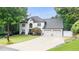 Charming two-story home with a manicured lawn and attached two-car garage at 5286 Wild Indigo Nw Way, Acworth, GA 30102