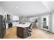 Open concept kitchen features stainless steel appliances, a center island with seating, and hardwood floors at 5286 Wild Indigo Nw Way, Acworth, GA 30102