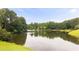 Scenic lake surrounded by lush greenery creates a picturesque setting at 5286 Wild Indigo Nw Way, Acworth, GA 30102