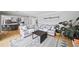 Open-concept living room connected to kitchen with large sectional sofa at 5286 Wild Indigo Nw Way, Acworth, GA 30102