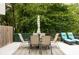 Backyard patio with a dining table set, lounge chairs, and outdoor rug at 5286 Wild Indigo Nw Way, Acworth, GA 30102