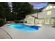 In-ground swimming pool featuring steps and a sunroom at 5286 Wild Indigo Nw Way, Acworth, GA 30102