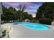 Swimming pool with mature trees, manicured lawn, and lush landscaping at 5286 Wild Indigo Nw Way, Acworth, GA 30102
