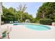 Backyard swimming pool area features lounge chairs, a fountain, and well-maintained landscaping at 5286 Wild Indigo Nw Way, Acworth, GA 30102