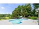 Sparkling pool offers a backyard oasis with a fence and lush landscaping at 5286 Wild Indigo Nw Way, Acworth, GA 30102