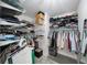 A spacious walk-in closet featuring metal racks, shelves and gray carpet flooring at 5286 Wild Indigo Nw Way, Acworth, GA 30102