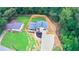 Aerial view of a house with a well-maintained lawn and newly installed fence at 6050 Randy Ln, Ellenwood, GA 30294