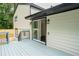 Backyard patio with sliding glass doors that enter into the house at 6050 Randy Ln, Ellenwood, GA 30294