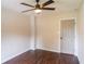 Bedroom featuring neutral walls, modern ceiling fan, and wood-look floors at 6050 Randy Ln, Ellenwood, GA 30294