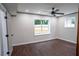 Bedroom featuring neutral paint, ceiling fan and two windows at 6050 Randy Ln, Ellenwood, GA 30294