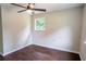 Charming bedroom with hardwood floors, ceiling fan, and sun-filled window at 6050 Randy Ln, Ellenwood, GA 30294