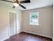 Bedroom featuring neutral walls, modern ceiling fan, and wood-look floors at 6050 Randy Ln, Ellenwood, GA 30294