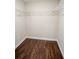 Walk-in closet with wood floor and wire shelving for optimal storage and organization at 6050 Randy Ln, Ellenwood, GA 30294