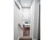 Hallway leading to open concept kitchen with stainless appliances and center island at 6050 Randy Ln, Ellenwood, GA 30294