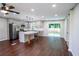 Bright, open-concept kitchen featuring stainless steel appliances, an island with seating, and plenty of counter space at 6050 Randy Ln, Ellenwood, GA 30294
