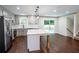 Bright, open-concept kitchen featuring stainless steel appliances, an island with seating, and plenty of counter space at 6050 Randy Ln, Ellenwood, GA 30294