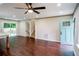 Open-concept living room with a sliding door, new flooring, and a view of the backyard, creating a seamless indoor-outdoor flow at 6050 Randy Ln, Ellenwood, GA 30294