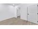 Clean bedroom with hardwood floors, white walls, and an ensuite at 108 Park Pl # 110, Decatur, GA 30030
