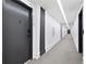 Long hallway with modern lighting and gray carpet in a building at 108 Park Pl # 110, Decatur, GA 30030