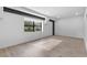Well-lit living room with a modern window, minimalist design, and light hardwood flooring at 108 Park Pl # 110, Decatur, GA 30030