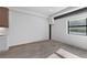 Bright living room with a modern window, minimalist design, and light hardwood flooring at 108 Park Pl # 110, Decatur, GA 30030