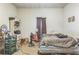 Bedroom with basic furnishings, window and disorganized storage at 1454 Beecher Sw St, Atlanta, GA 30310