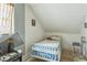 Small bedroom featuring a single bed, window and limited space at 1454 Beecher Sw St, Atlanta, GA 30310