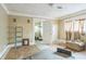 Bedroom with hardwood floors, large windows, and walk-in closet at 1454 Beecher Sw St, Atlanta, GA 30310