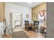 Dining room with hardwood floors, natural light, and an open doorway to the kitchen at 1454 Beecher Sw St, Atlanta, GA 30310