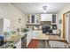 Kitchen featuring white cabinets, updated countertops and black appliances at 1454 Beecher Sw St, Atlanta, GA 30310