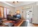 Cozy living room featuring hardwood floors, a large window, and an open doorway at 1454 Beecher Sw St, Atlanta, GA 30310