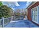 Relaxing back deck with wooden railings and views of the surrounding yard and neighborhood at 2324 Blackberry Ct, Snellville, GA 30078