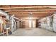 Spacious unfinished basement for storage with exposed ceiling and access to utilities at 2324 Blackberry Ct, Snellville, GA 30078