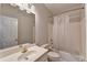 Functional bathroom with a tub-shower combo, vanity with mirror, and white fixtures at 2324 Blackberry Ct, Snellville, GA 30078