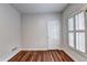 This is a cozy room with hardwood floors and white walls, offering a clean and bright space at 2324 Blackberry Ct, Snellville, GA 30078