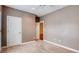Bright bedroom featuring neutral carpet, light gray walls, and open doorway to adjacent room at 2324 Blackberry Ct, Snellville, GA 30078