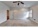 This is a neutral bedroom with cozy carpet, neutral paint and a view through the large window at 2324 Blackberry Ct, Snellville, GA 30078