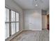 Bright bedroom featuring neutral carpet, gray walls, plantation shutters, and open doorway to adjacent room at 2324 Blackberry Ct, Snellville, GA 30078