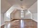 Large bonus room featuring wood floors, vaulted ceilings and plenty of natural light at 2324 Blackberry Ct, Snellville, GA 30078