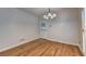 Clean dining room with hardwood floors and ample lighting is waiting for your personal touch at 2324 Blackberry Ct, Snellville, GA 30078