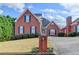 Beautiful brick home with a manicured lawn, blue shutters, and a welcoming driveway at 2324 Blackberry Ct, Snellville, GA 30078