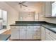 Charming kitchen featuring ample counter space, a breakfast bar, and hardwood floors at 2324 Blackberry Ct, Snellville, GA 30078