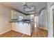 Traditional white kitchen boasts ample counter space and modern appliances with a breakfast bar, perfect for casual dining at 2324 Blackberry Ct, Snellville, GA 30078