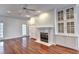 Spacious living room with hardwood floors, fireplace, and built-in cabinetry at 2324 Blackberry Ct, Snellville, GA 30078