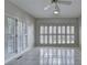 Spacious living room features tile flooring, white walls and windows with white shutters at 2324 Blackberry Ct, Snellville, GA 30078