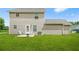 Spacious backyard, featuring a patio with patio furniture, grill, and a lush lawn at 30 Creek Bottom Dr, Covington, GA 30014