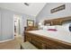 Bedroom with a wooden bed frame, carpeted floors, and vaulted ceilings at 30 Creek Bottom Dr, Covington, GA 30014