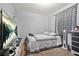 This bedroom features carpet floors and a gray and white color scheme, complete with a large TV at 30 Creek Bottom Dr, Covington, GA 30014