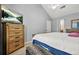 Bedroom features vaulted ceilings, ceiling fan, and chest of drawers at 30 Creek Bottom Dr, Covington, GA 30014